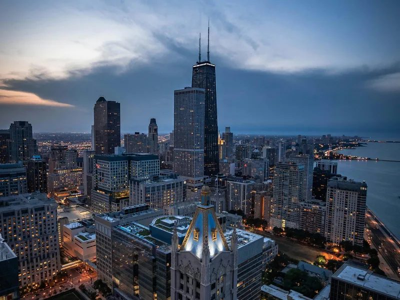 Chicago skyline and lakefront at dusk.