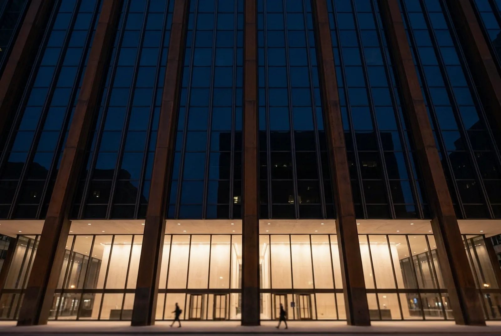 Illustration: weathered steel columns and dark glass of a modernist civic building in the Chicago Loop at dusk