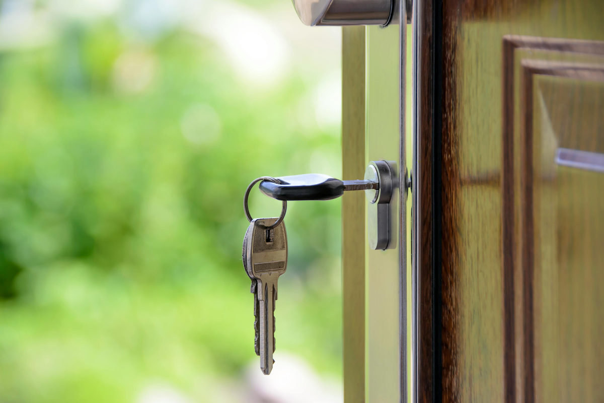 Keys hanging from a door lock.