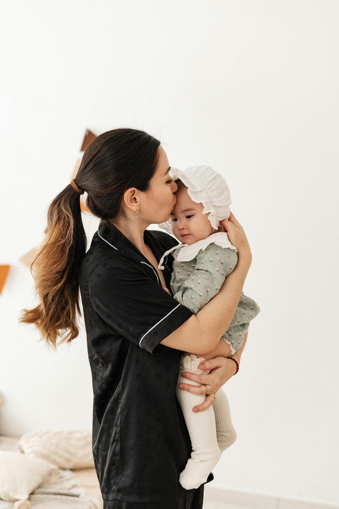 mom holding child