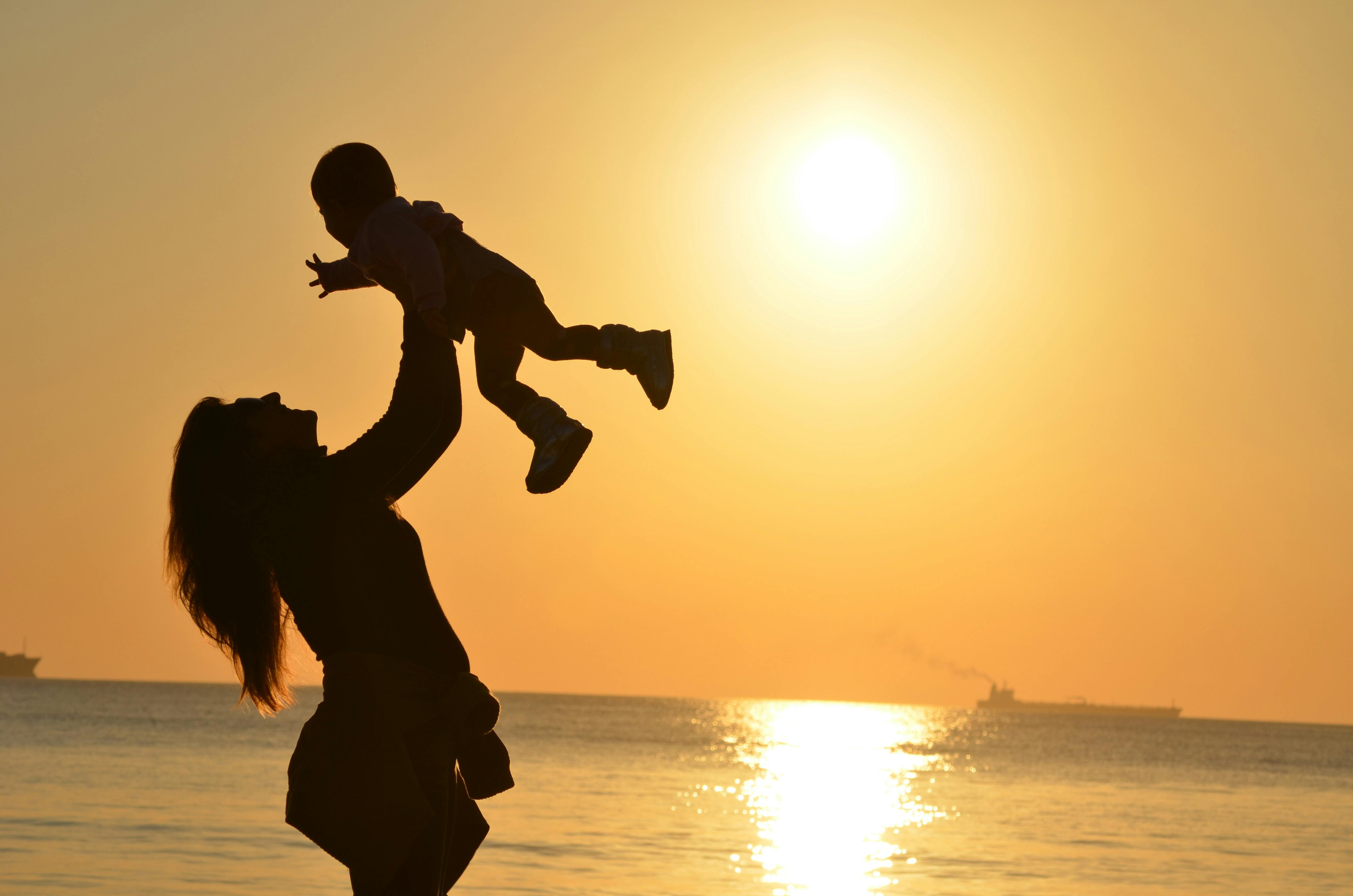 mom and child on beach