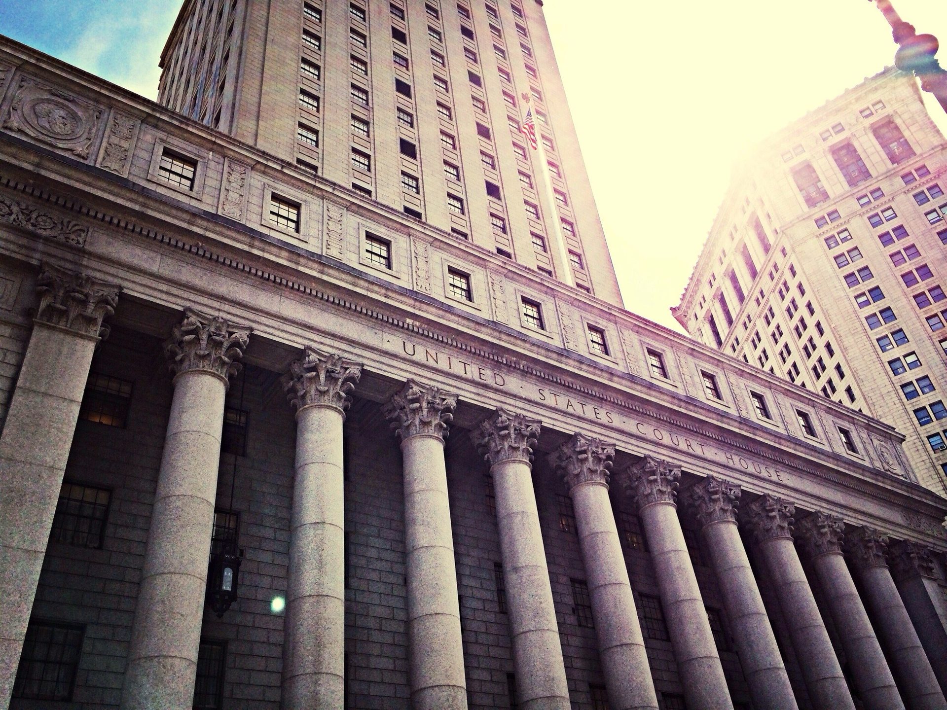 A large stone building with a columned entrance.