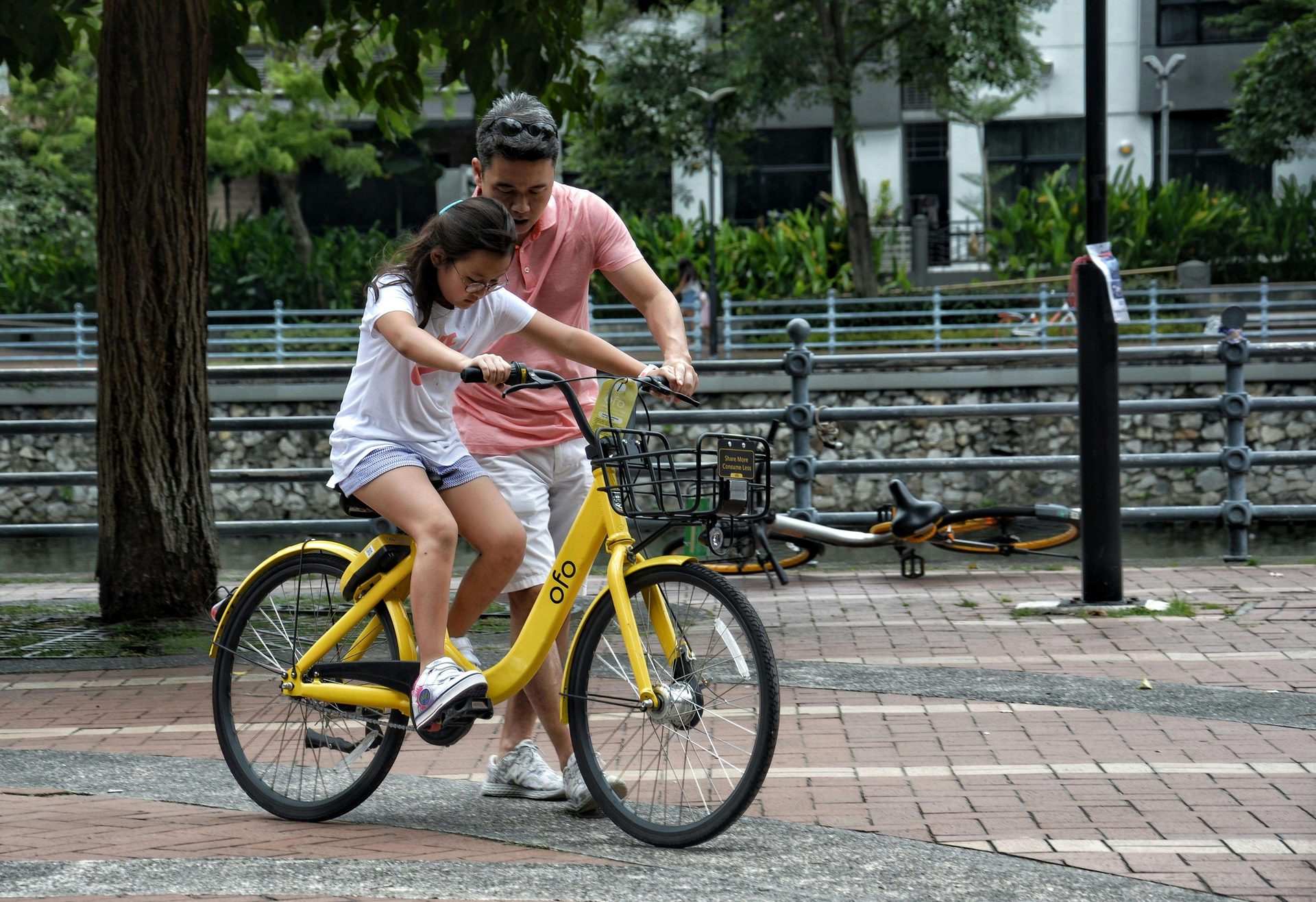 father and daughter biking